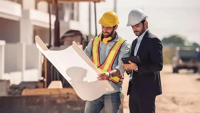 Engineers reviewing plans